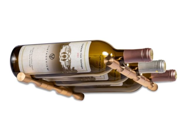 two gold pins holding three bottles of wine