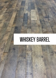 a dark wooden floor with the words 'Whiskey Barrel' outlined in white