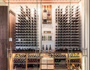 a front view of a wall with glass and metal wine racks
